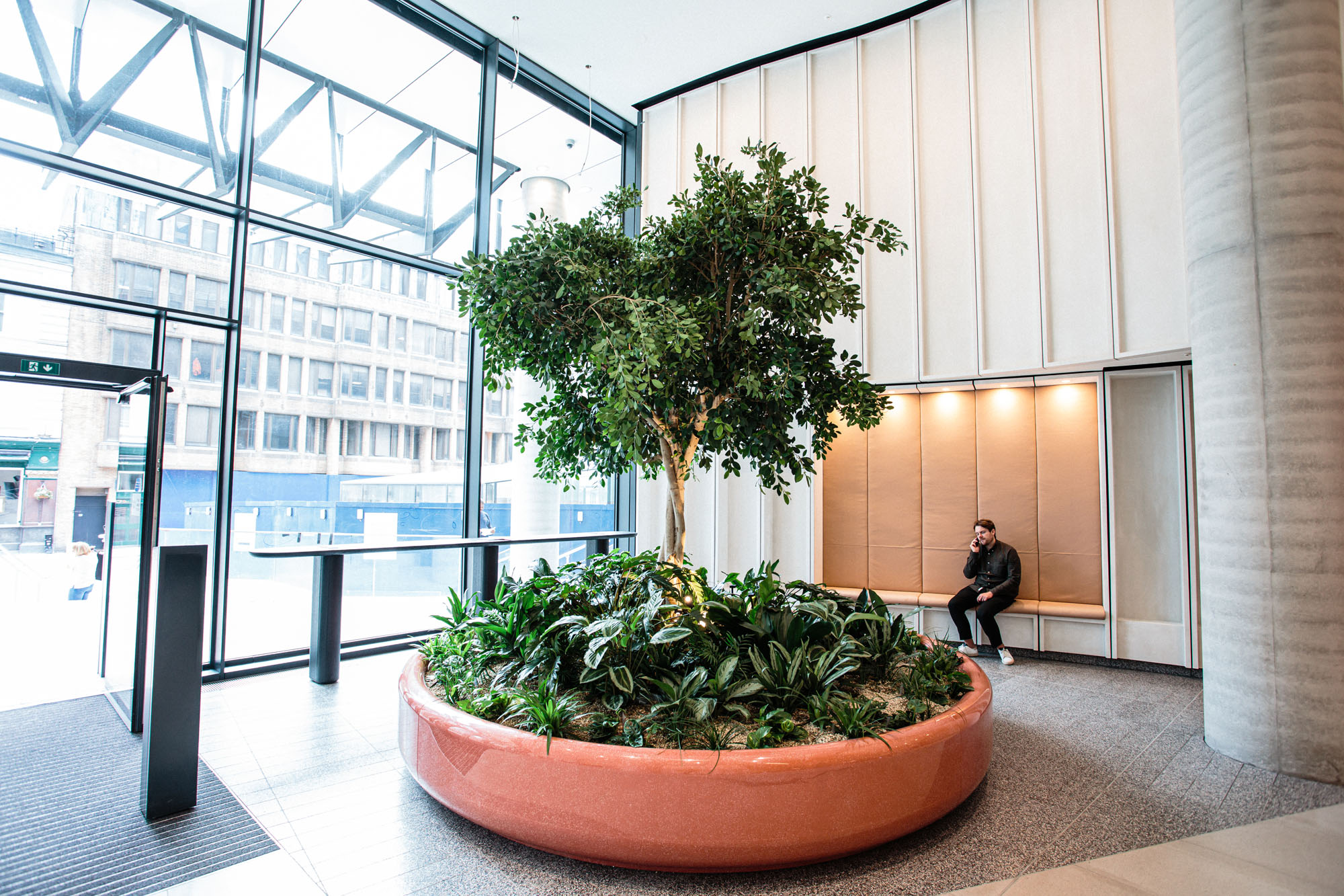 plants in circular bed in office building