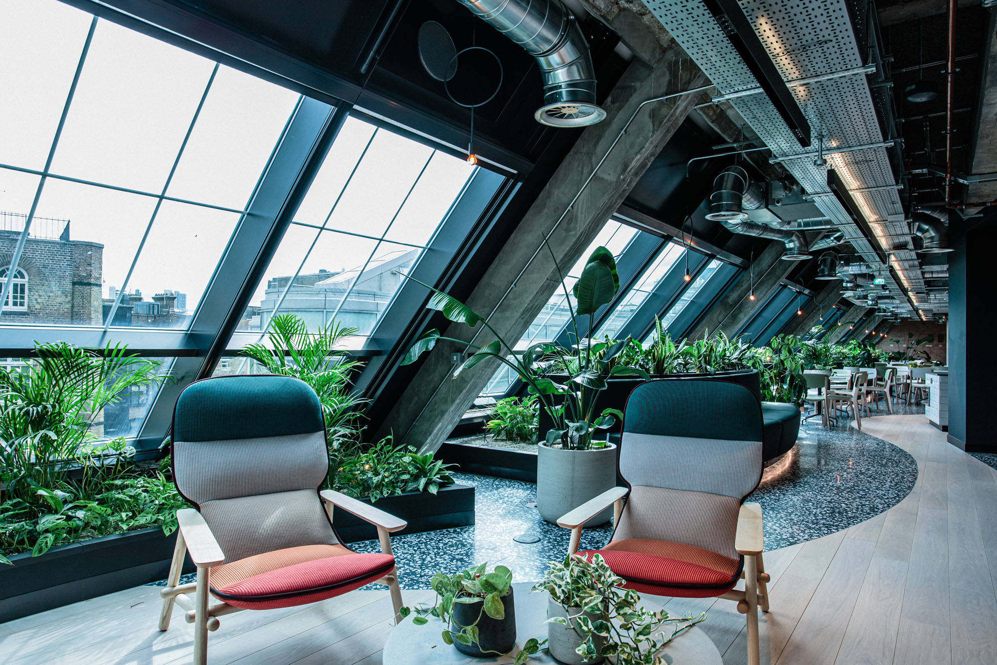 plants in seating area in building