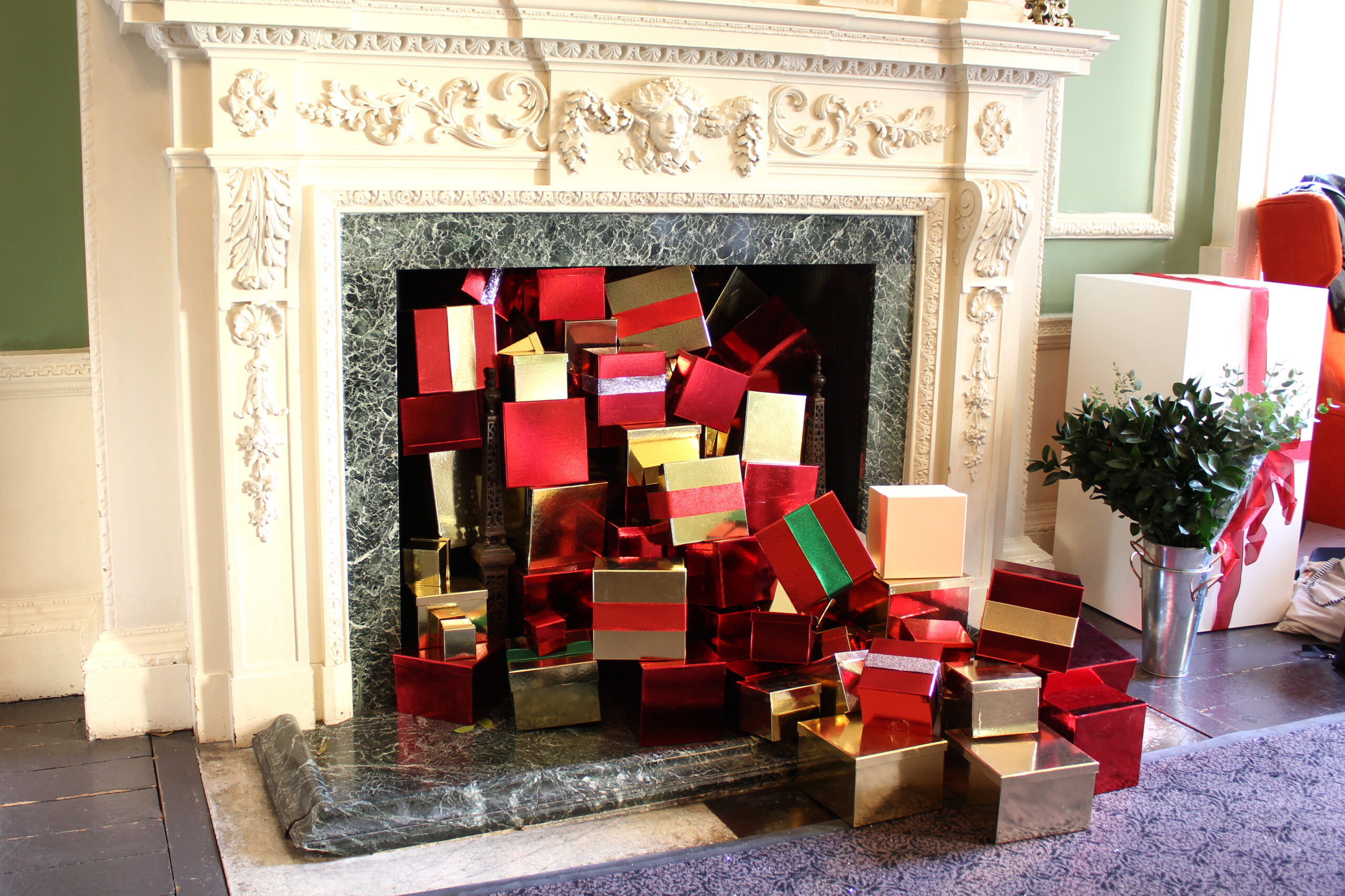 christmas presents in front of fire place